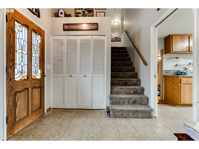 a view of an entryway with wooden floor