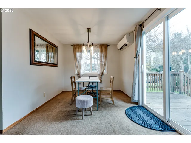 a view of a livingroom with furniture window and wooden floor