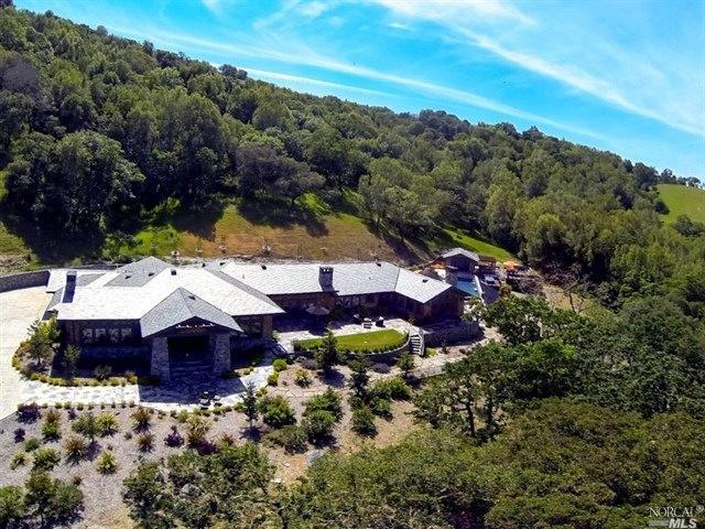 a view of a house with a mountain yard
