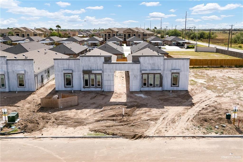 2612 West Harrison Avenue Alton, TX 78573 - Photo 2 of 7 a front view of a house with a yard