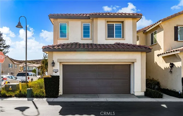 a front view of a house with a garage