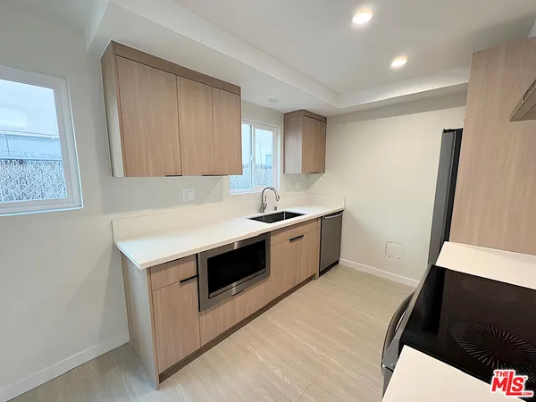 a kitchen with a stove and a microwave