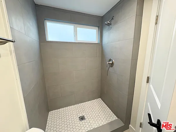 a bathroom with a sink and a shower
