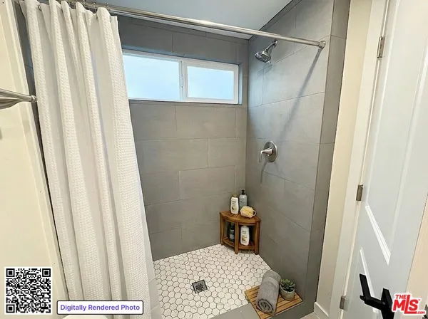 a bathroom with a sink and a shower