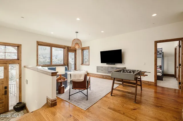a view of a brick house with large windows and a table