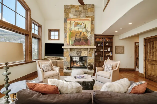 a living room with fireplace furniture and a flat screen tv