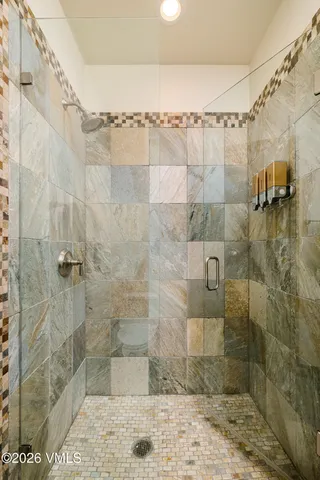 a bedroom with bed and wooden floor