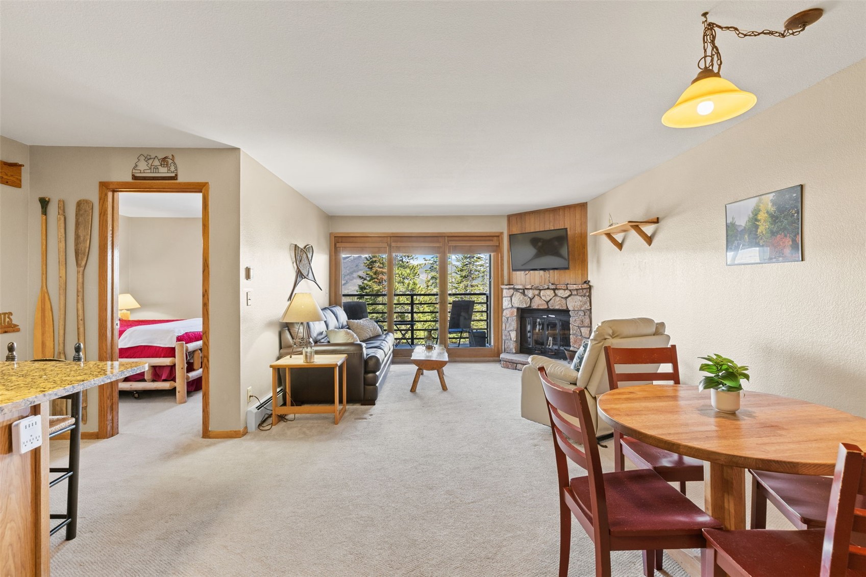 89410 Ryan Gulch Road, Unit DD301 Silverthorne, CO 80498 - Photo 6 of 28 a view of a livingroom with furniture and a table chair