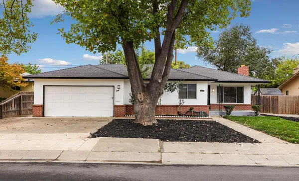 a front view of a house with yard