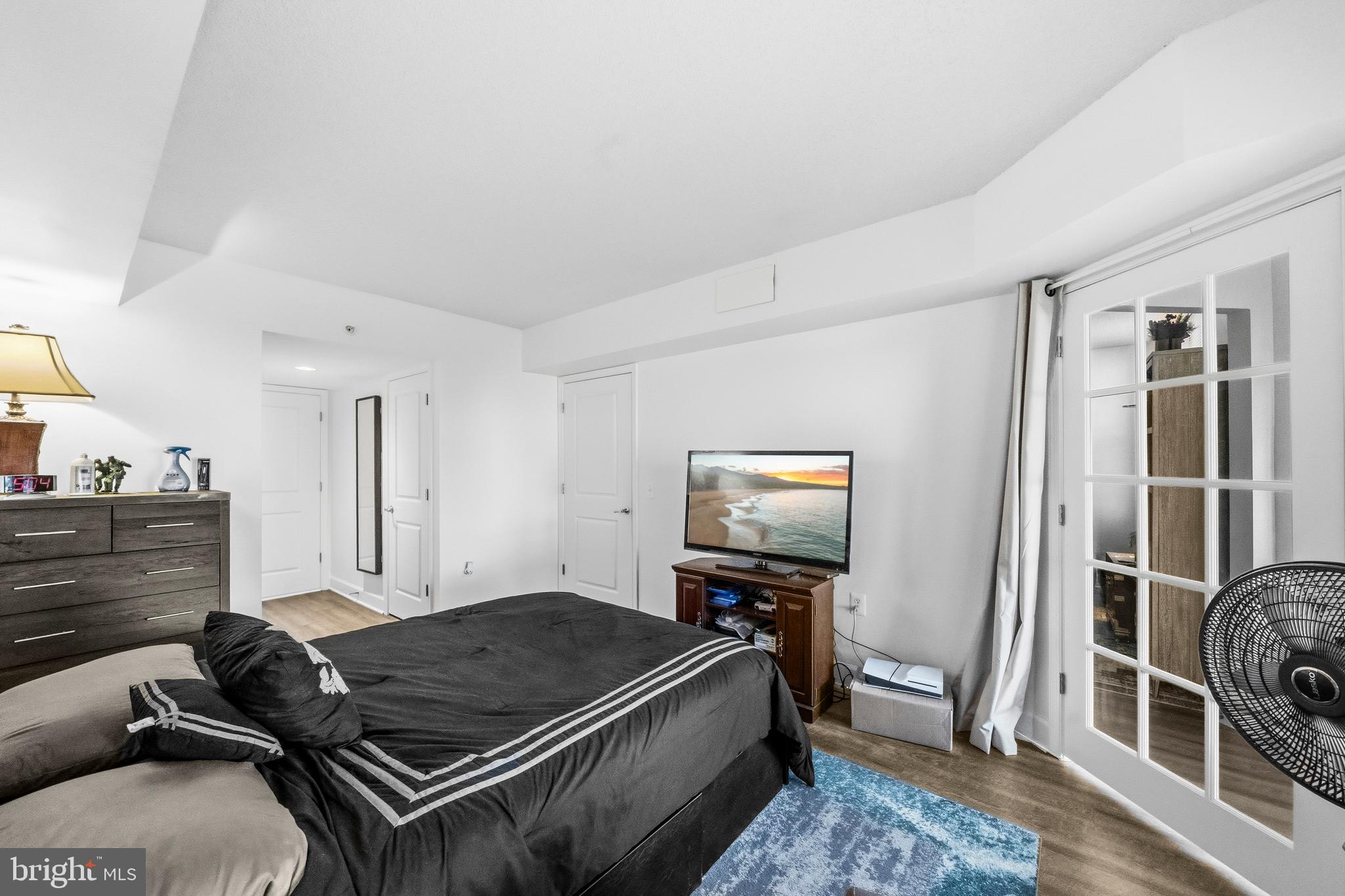 11800 Sunset Hills Road, Unit 726 Reston, VA 20190 - Photo 20 of 36 a living room with furniture and a flat screen tv