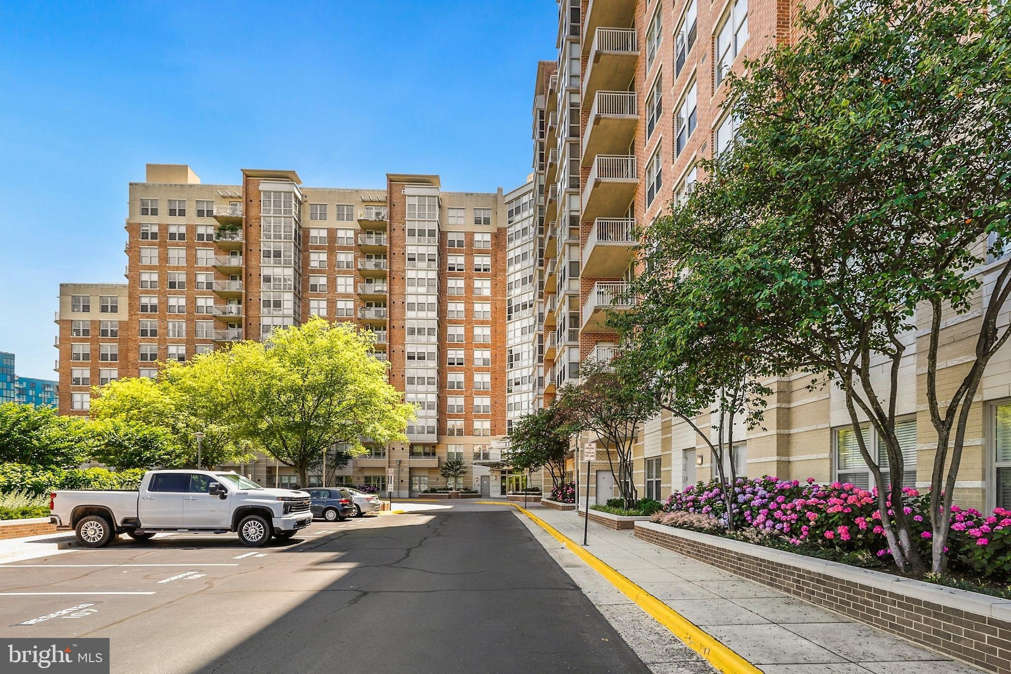 11800 Sunset Hills Road, Unit 726 Reston, VA 20190 - Photo 22 of 36 a cars parked in front of a building