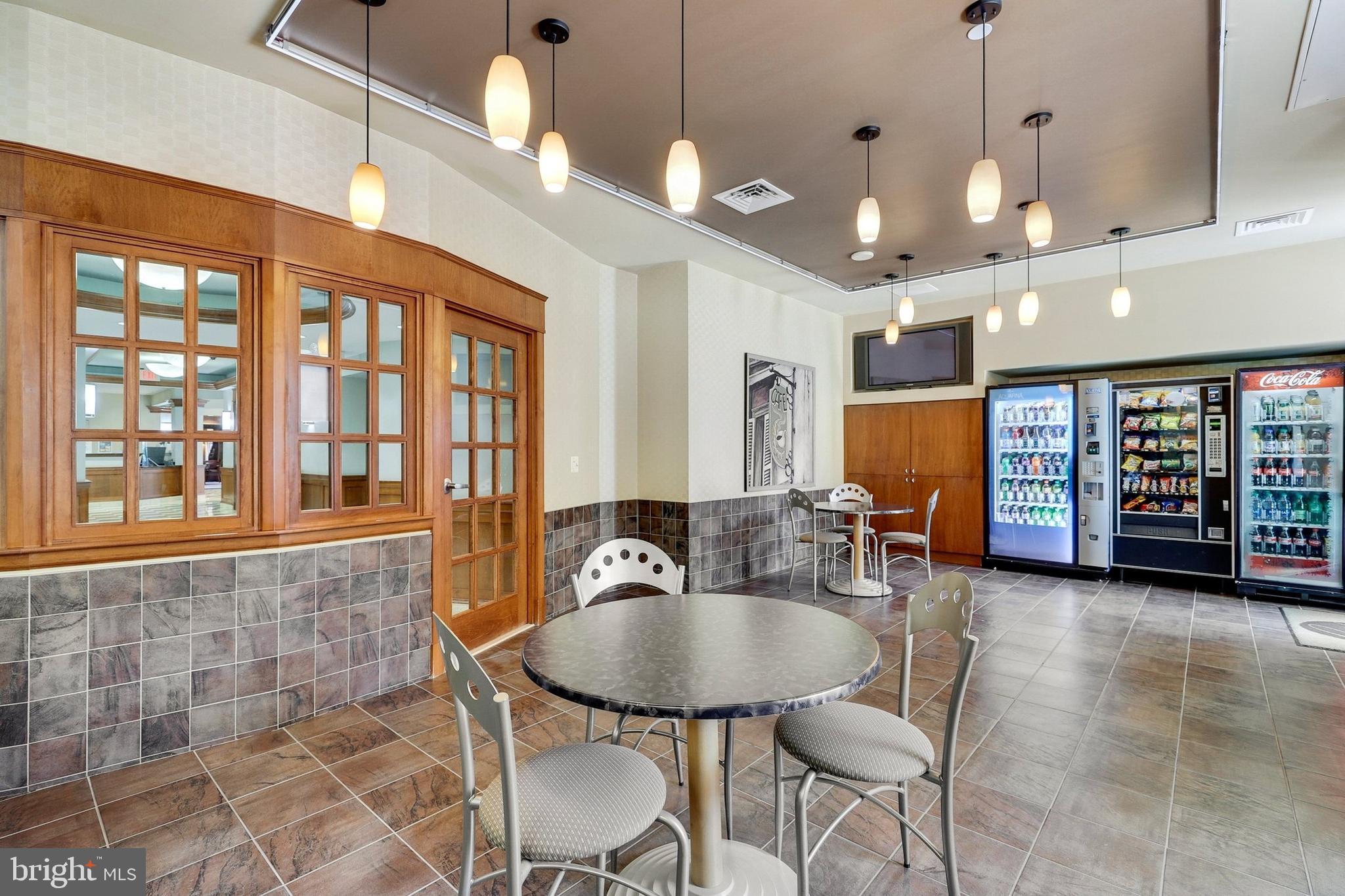 11800 Sunset Hills Road, Unit 726 Reston, VA 20190 - Photo 25 of 36 a dining room with furniture and window