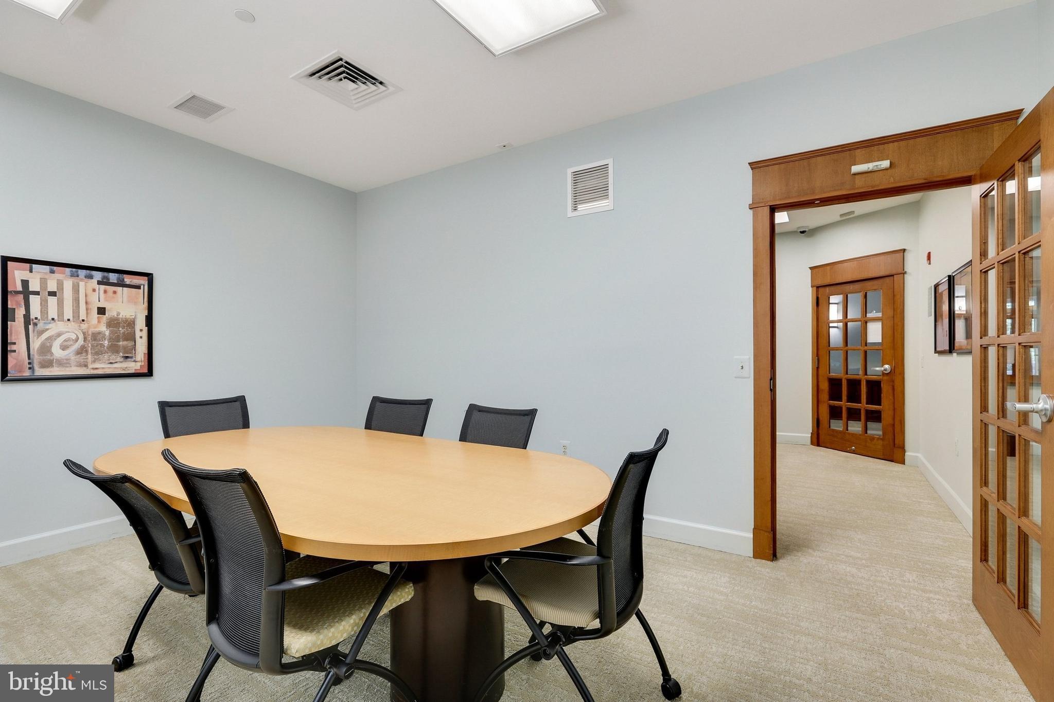 11800 Sunset Hills Road, Unit 726 Reston, VA 20190 - Photo 28 of 36 a view of a dining room with furniture