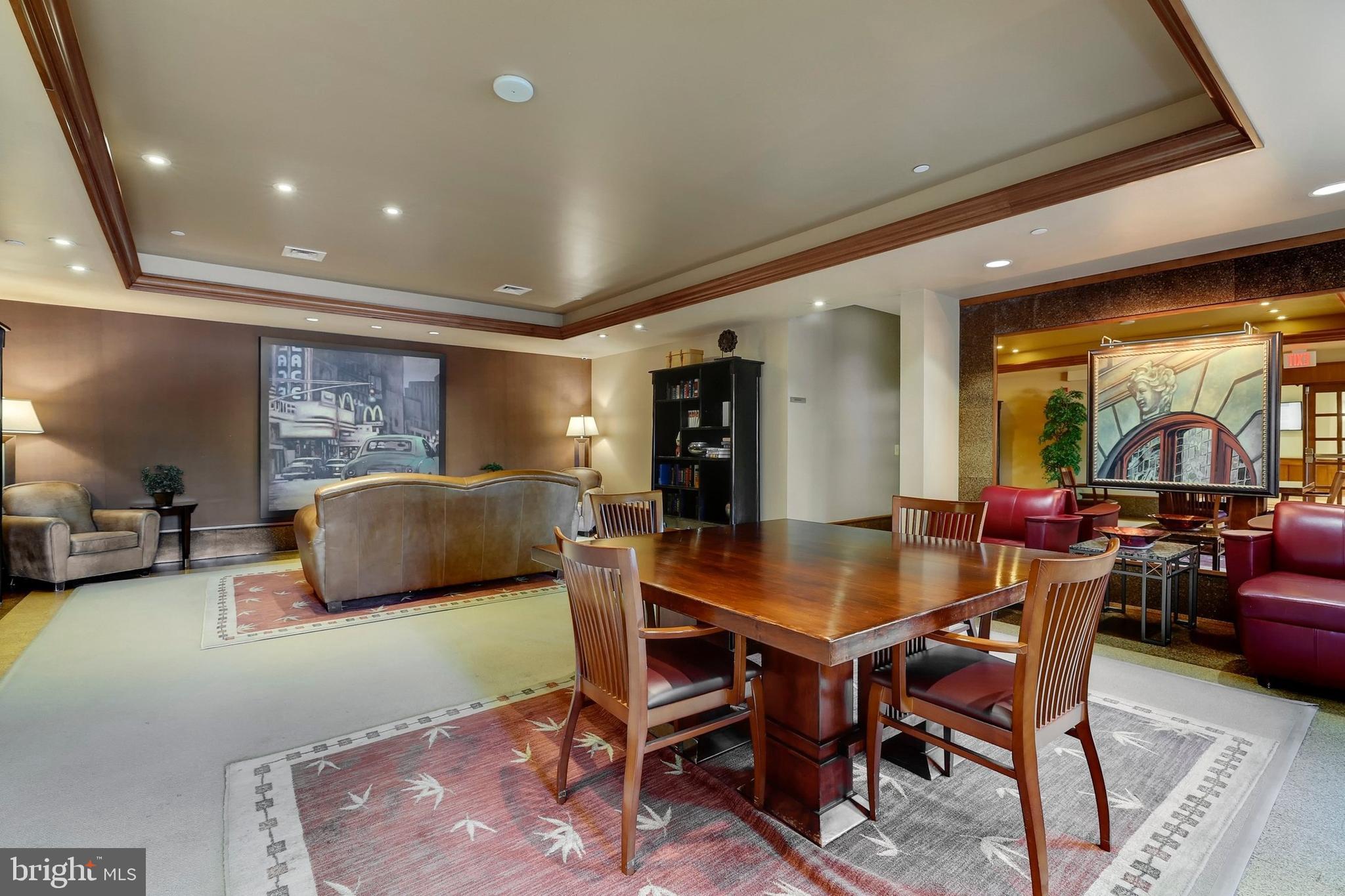 11800 Sunset Hills Road, Unit 726 Reston, VA 20190 - Photo 29 of 36 a dining room with furniture and a rug