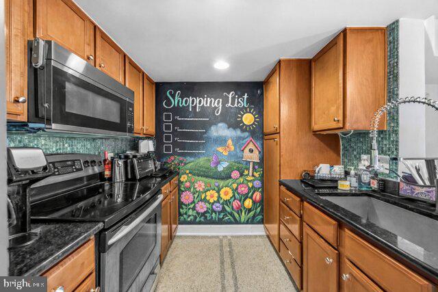 11800 Sunset Hills Road, Unit 726 Reston, VA 20190 - Photo 5 of 36 a kitchen with stainless steel appliances a sink and a microwave