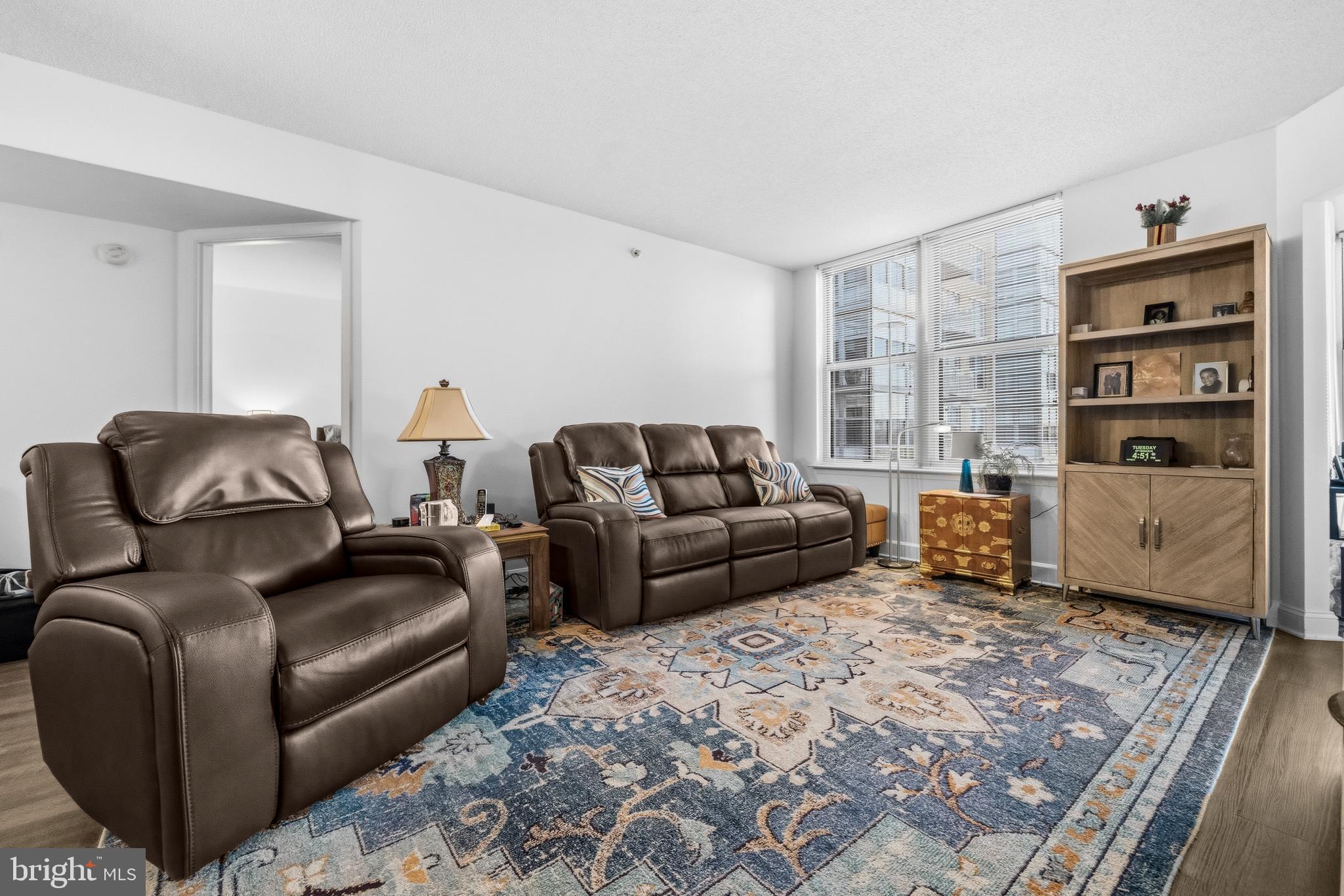 11800 Sunset Hills Road, Unit 726 Reston, VA 20190 - Photo 8 of 36 a living room with furniture or couch and a bookshelf