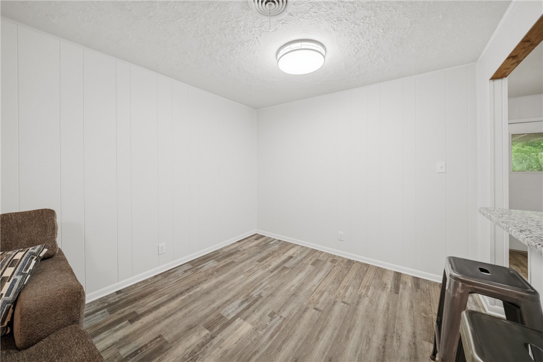 415 West Decherd Street Franklin, TX 77856 - Photo 11 of 28 a view of a room with wooden floor and bathroom