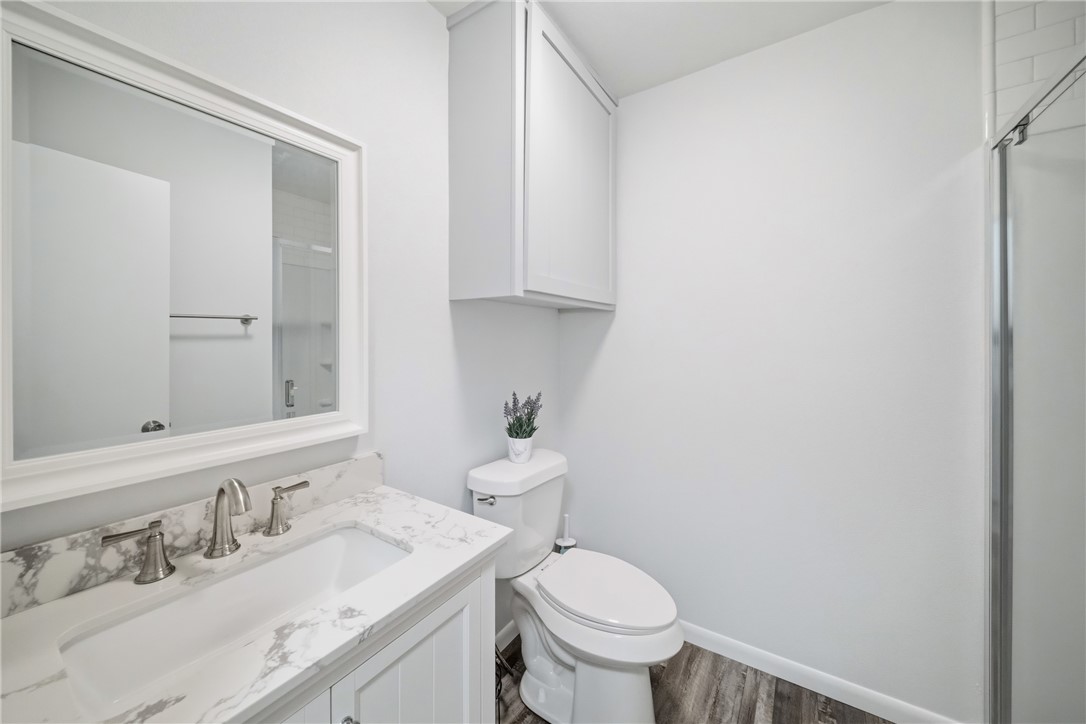 415 West Decherd Street Franklin, TX 77856 - Photo 17 of 28 a bathroom with a sink a toilet and mirror