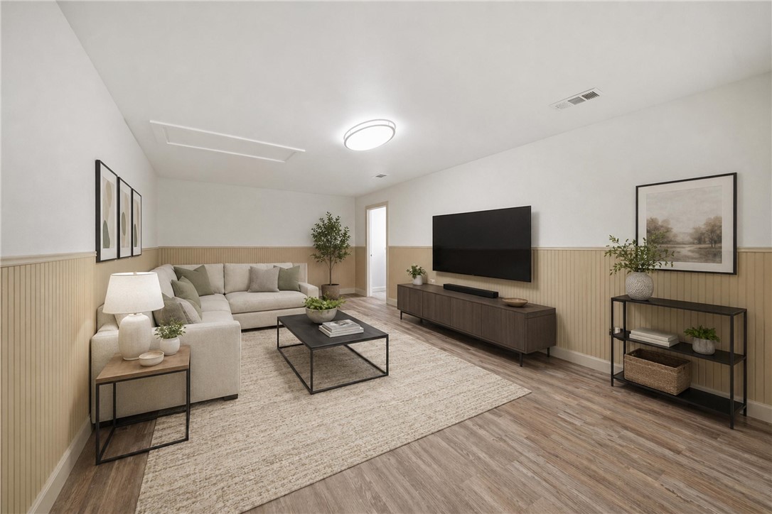415 West Decherd Street Franklin, TX 77856 - Photo 18 of 28 a living room with furniture and a flat screen tv