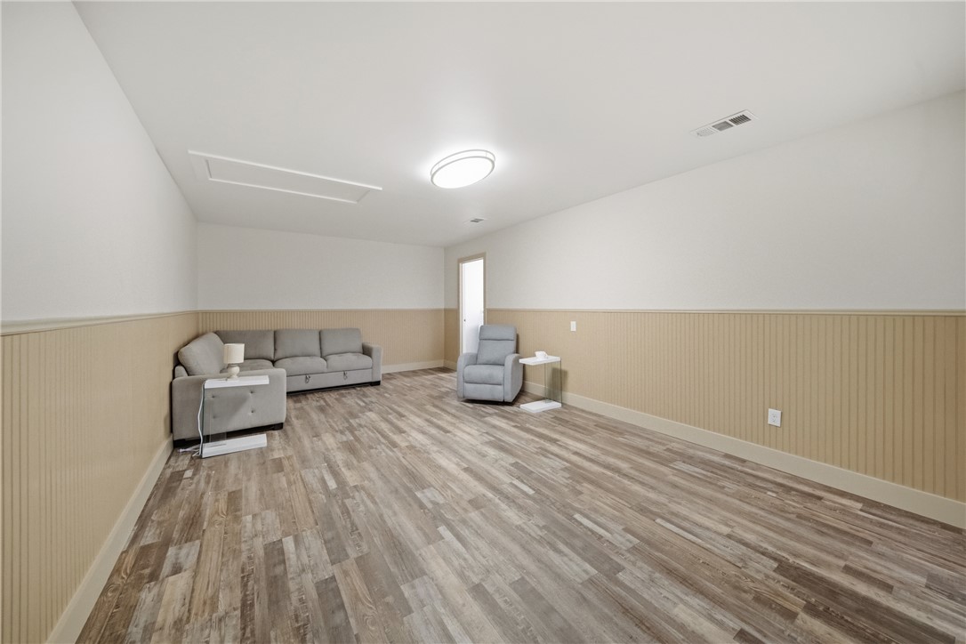 415 West Decherd Street Franklin, TX 77856 - Photo 19 of 28 a living room with furniture and a wooden floor