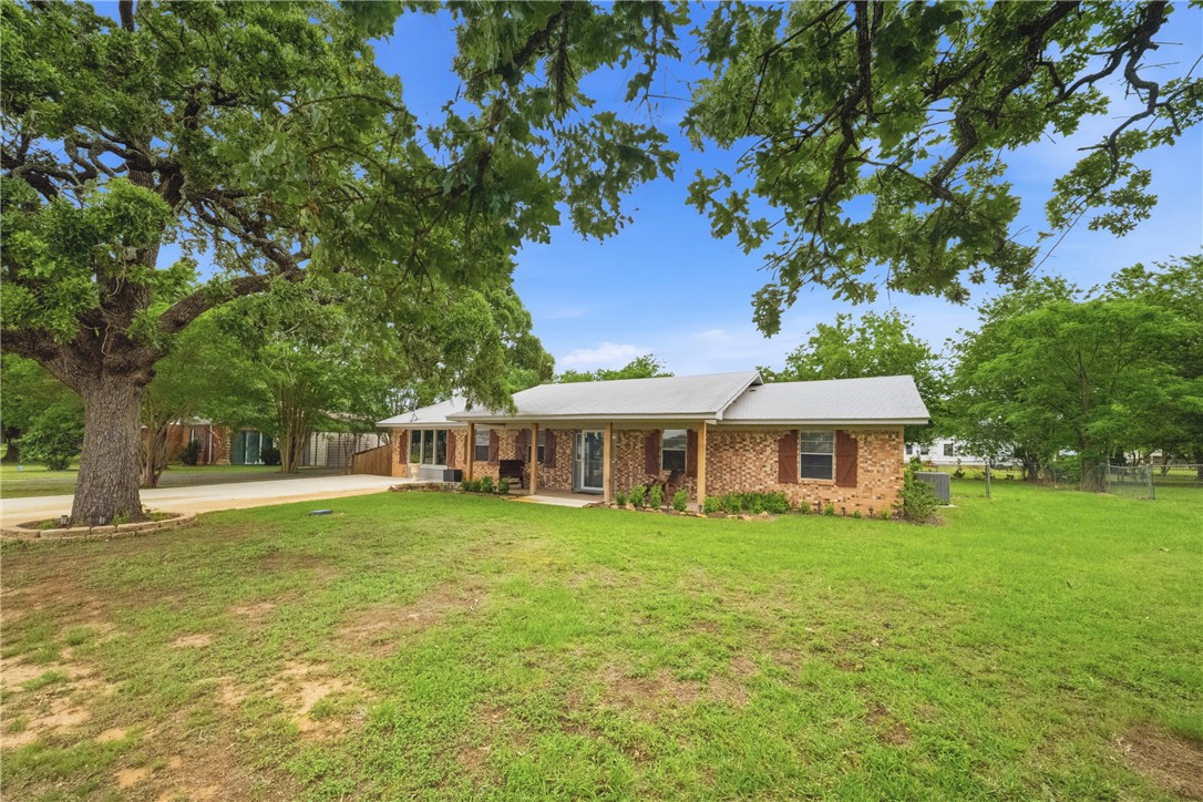 415 West Decherd Street Franklin, TX 77856 - Photo 22 of 28 a view of a house with a yard