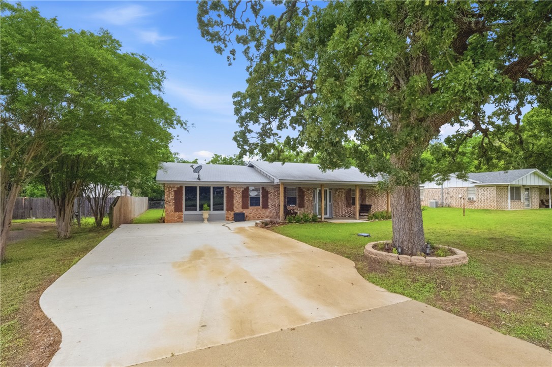 415 West Decherd Street Franklin, TX 77856 - Photo 25 of 28 a front view of a house with garden