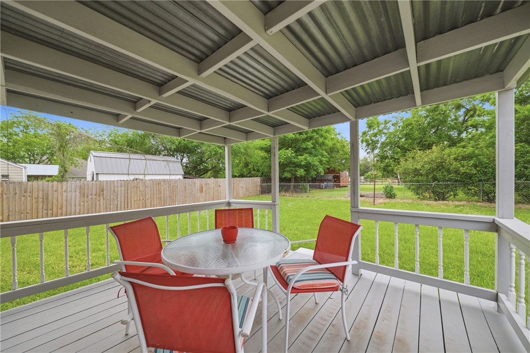 415 West Decherd Street Franklin, TX 77856 - Photo 28 of 28 a view of a patio with a table chairs and a backyard