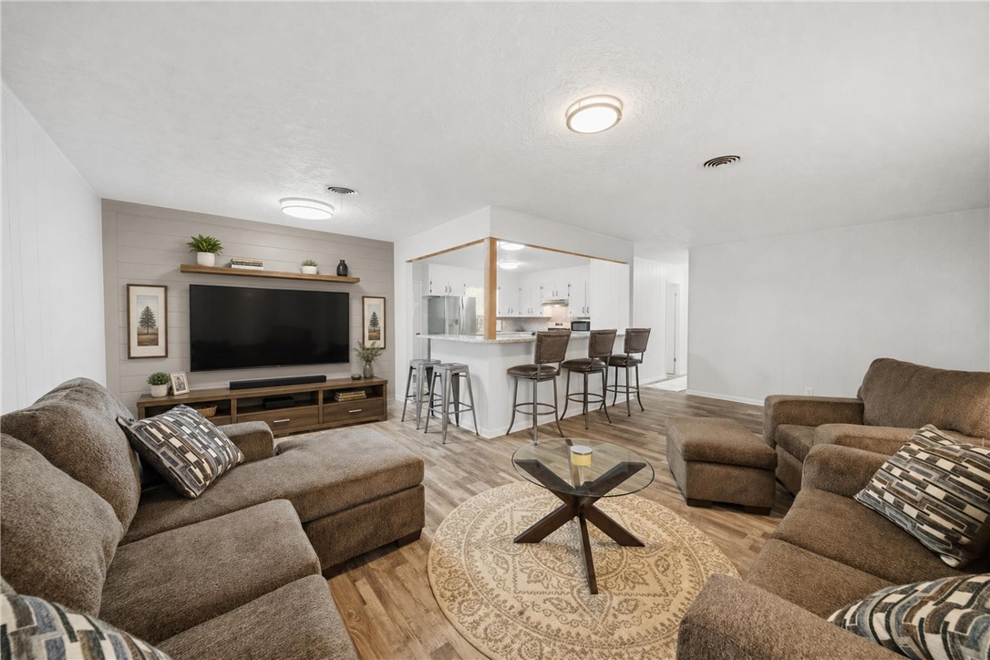 415 West Decherd Street Franklin, TX 77856 - Photo 4 of 28 a living room with furniture and a flat screen tv
