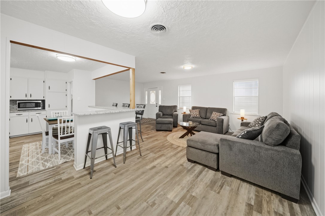 415 West Decherd Street Franklin, TX 77856 - Photo 7 of 28 a living room with furniture and a wooden floor
