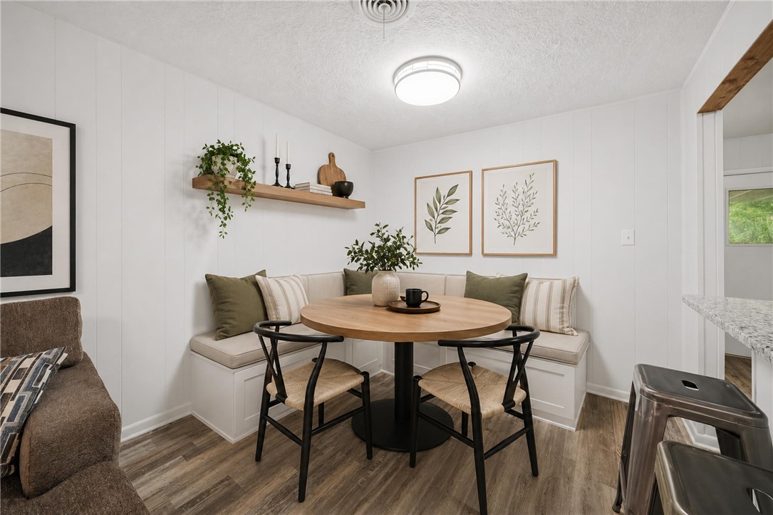 415 West Decherd Street Franklin, TX 77856 - Photo 10 of 28 a view of a dining room with furniture and wooden floor