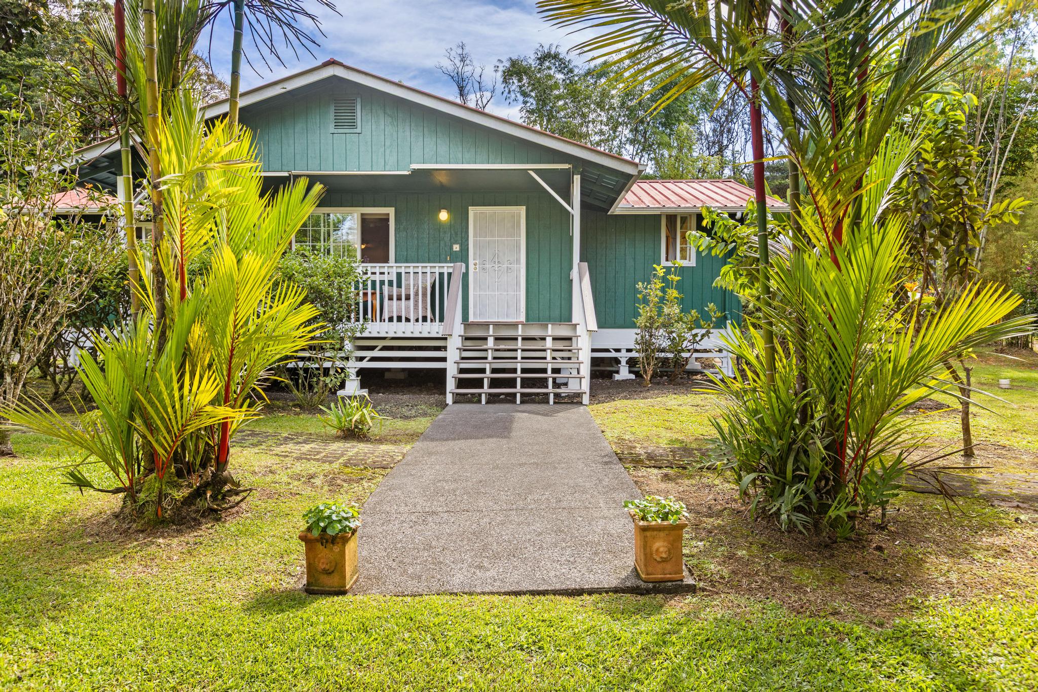 a front view of a house with garden