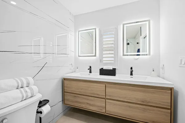 a bathroom with a toilet and shower
