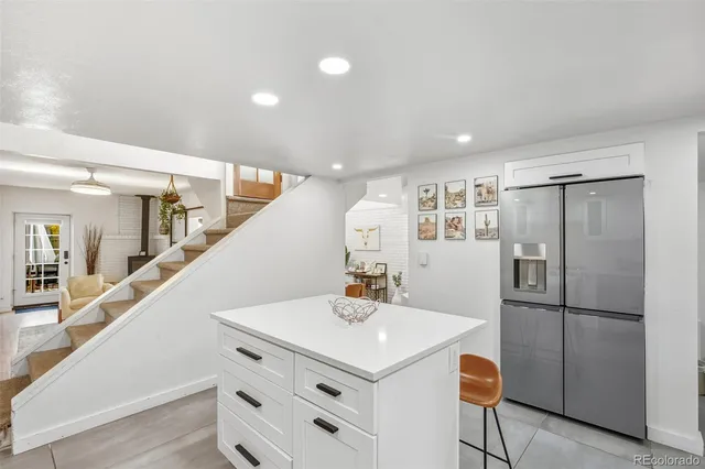 a kitchen with a refrigerator a sink and a refrigerator