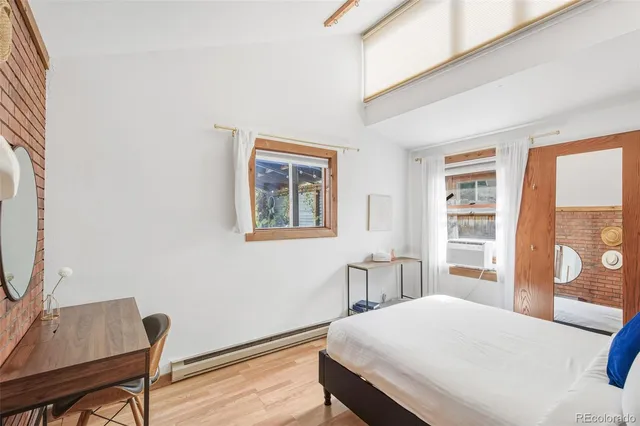 a bedroom with furniture and a window