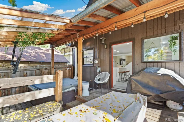 a view of a chairs and table in a patio