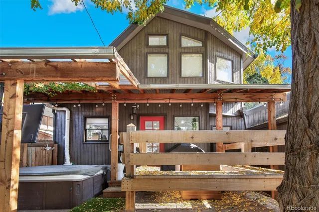 a front view of a house with outdoor seating