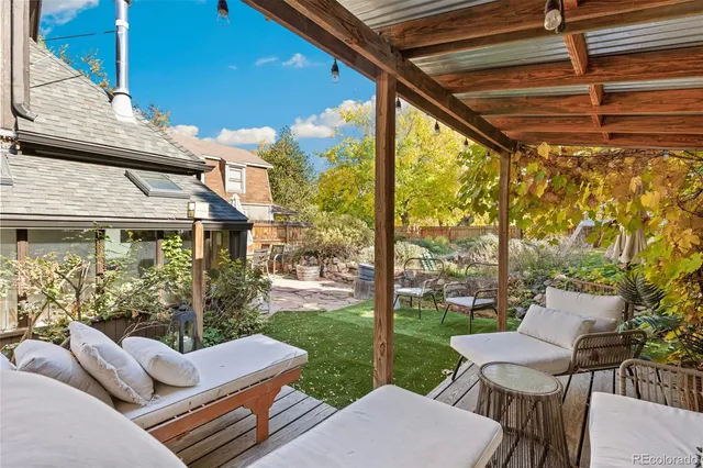 a view of a patio with couches chairs and a table and chairs