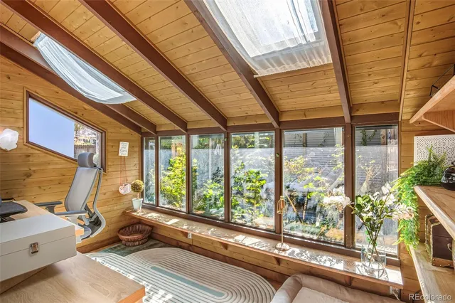 a living room with large windows