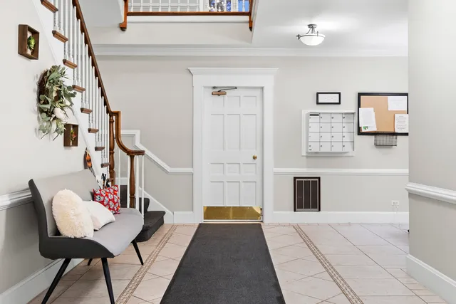 a living room with furniture and a rug