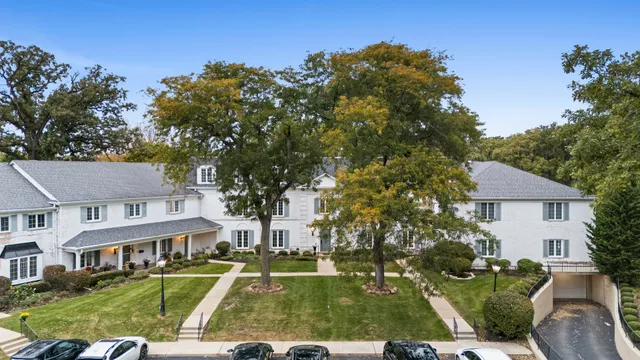 an aerial view of a residential apartment building with a yard