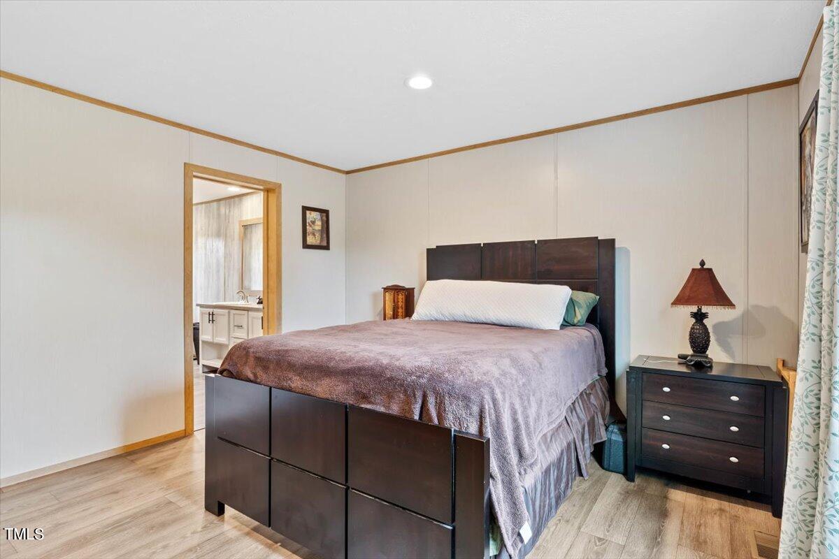 5324 Red Hill Church Road Coats, NC 27521 - Photo 36 of 54 a bedroom with a bed and a closet