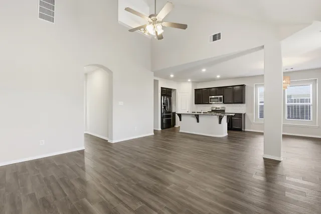 a view of kitchen with cabinets and wooden floor