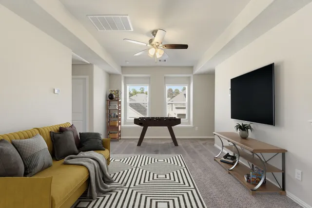 a living room with a couch and a flat screen tv