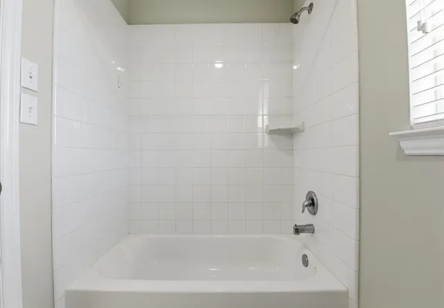 a close up of a bathtub curtain