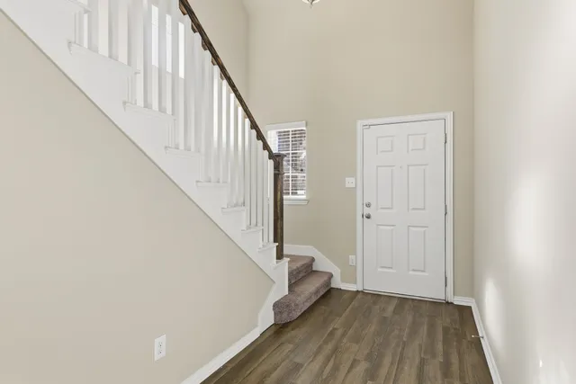 a view of entryway with wooden floor