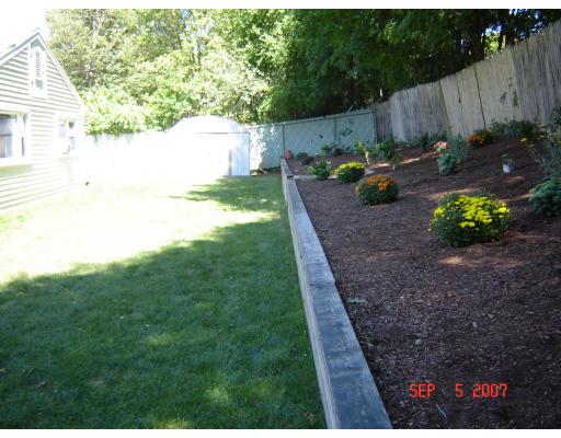 17 Waring Road Natick, MA 01760 - Photo 13 of 13 a backyard of a house with lots of green space