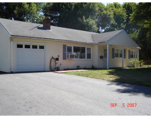 17 Waring Road Natick, MA 01760 - Photo 10 of 13 a front view of a house with a yard and garage