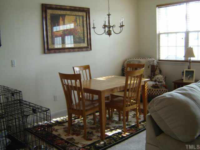 8237 Martello Lane Raleigh, NC 27613 - Photo 2 of 10 a view of a dining room with furniture