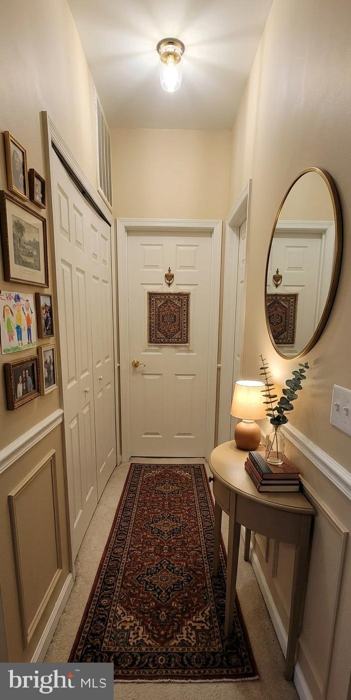 356 Main Street, Unit 300 Gaithersburg, MD 20878 - Photo 11 of 23 Inviting hallway with warm, welcoming charm.