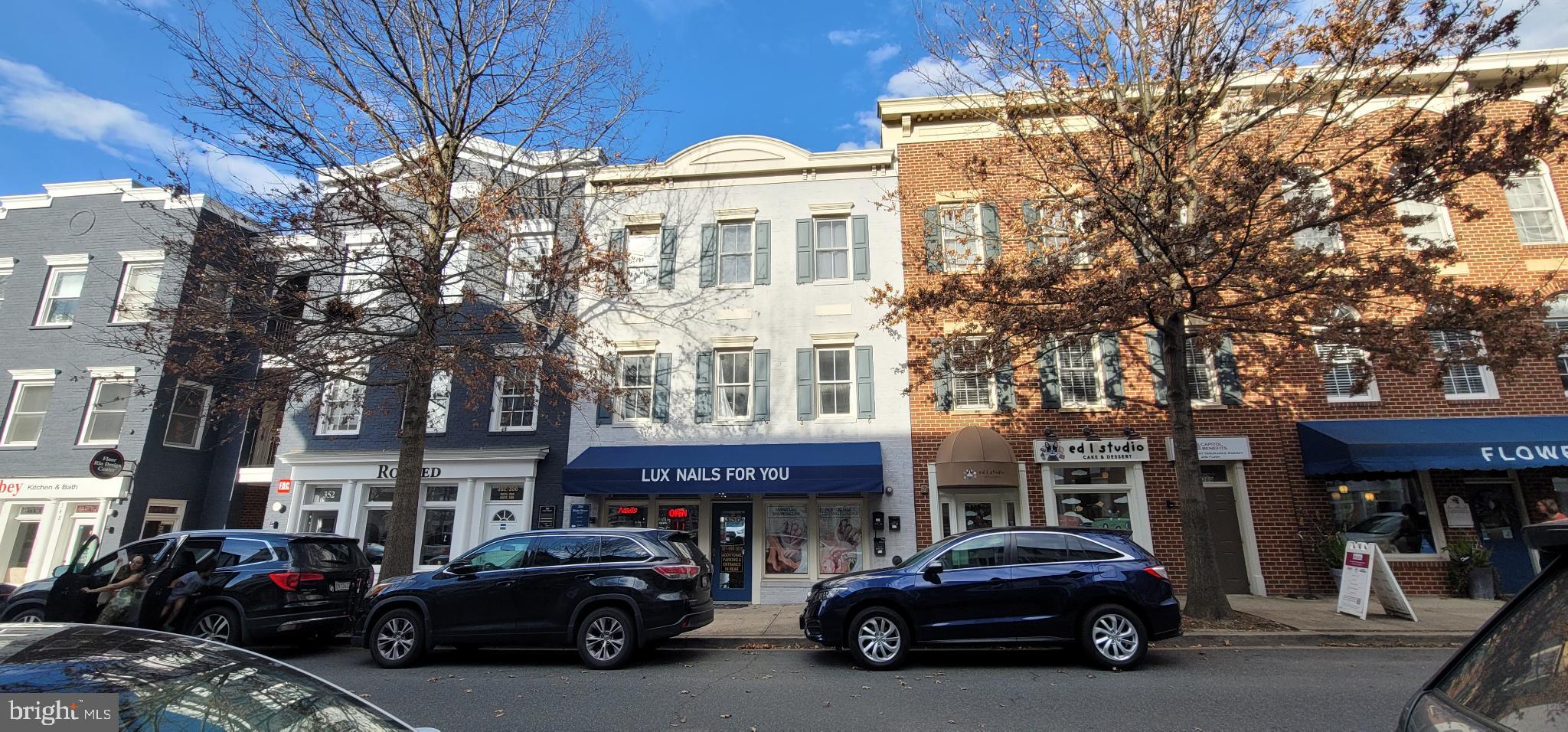 356 Main Street, Unit 300 Gaithersburg, MD 20878 - Photo 21 of 23 Charming storefronts line a vibrant street.